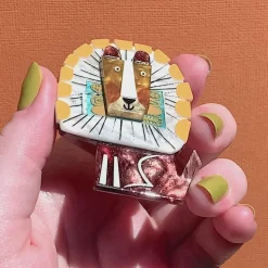 Erstwilder A Lion Named Roar Brooch^ Brooches