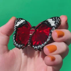 Erstwilder Wings Laced In Red Brooch^ Brooches